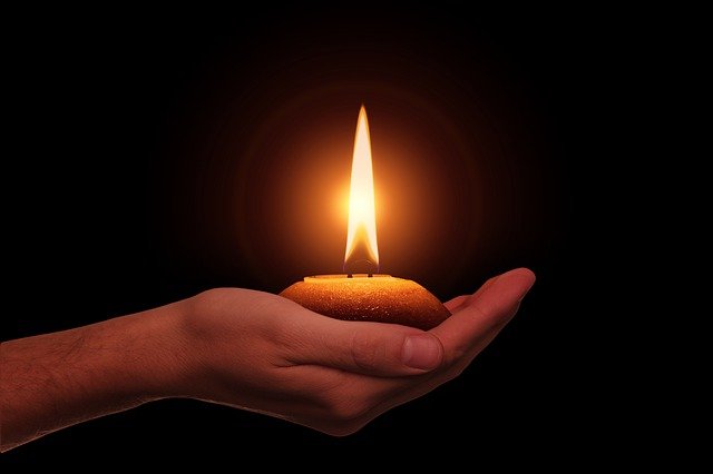 diwali diya on palm